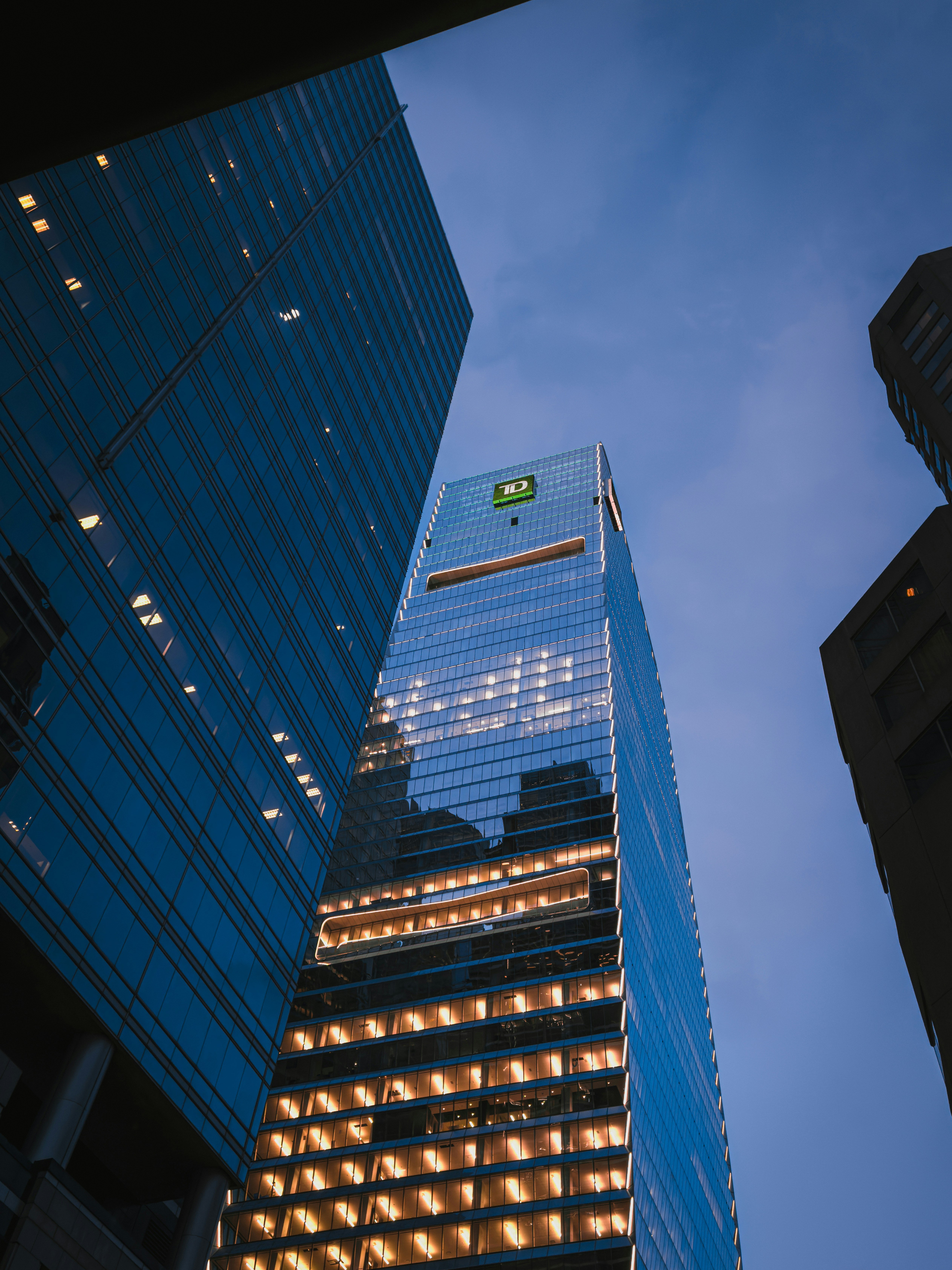 TD office tower in Toronto photographed from below against an evening sky